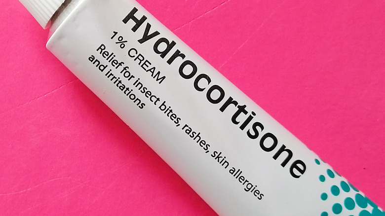 hydrocortisone cream tube on pink background