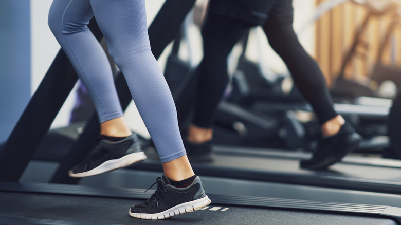 women exercising on treadmills