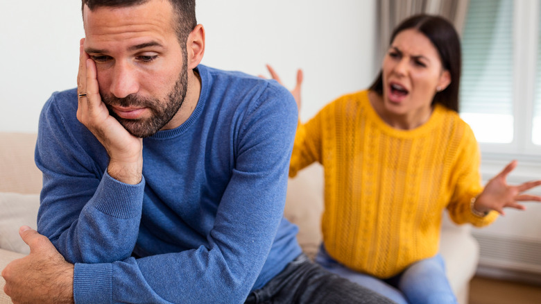 Young woman yelling at man