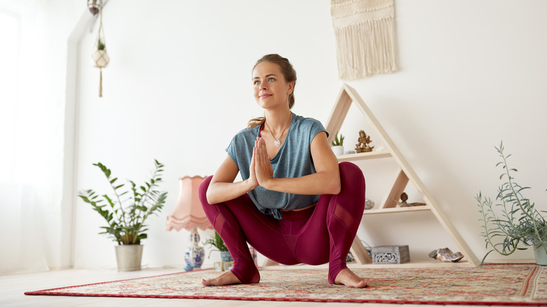 woman doing yoga squat