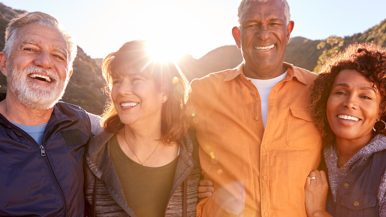 older people smiling outdoors