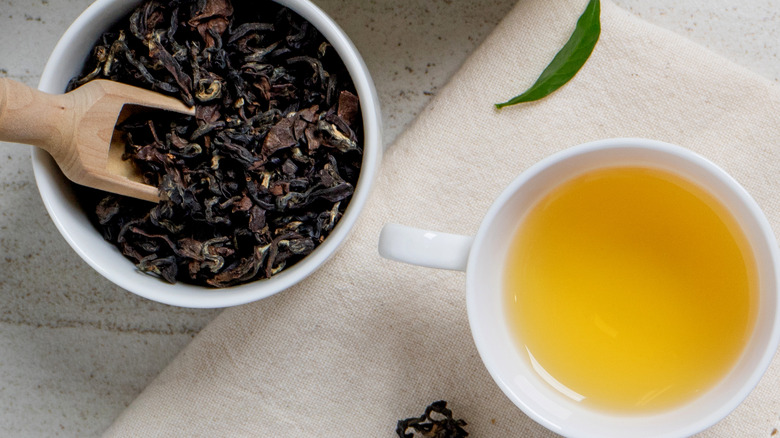 Green tea leaves and cup