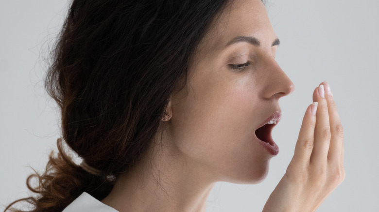 woman checking own breath