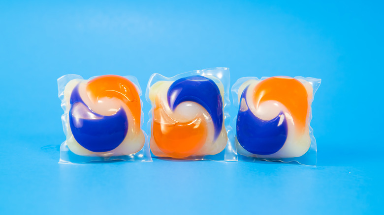 laundry pods on blue background