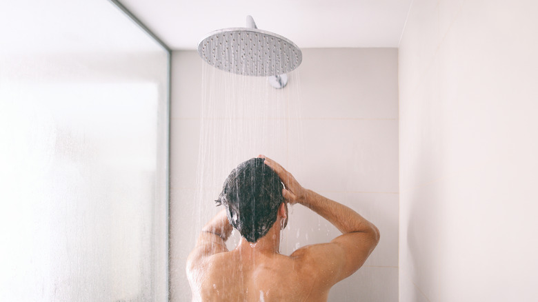 A man is taking a shower