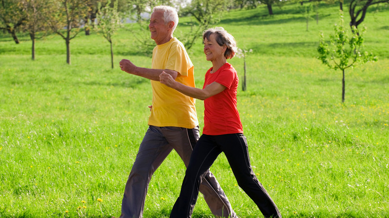 Mature couple power walking 