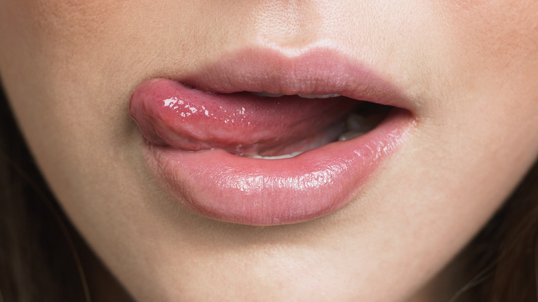 Person moving tongue to the side