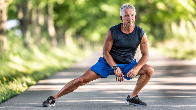 man stretching before a run