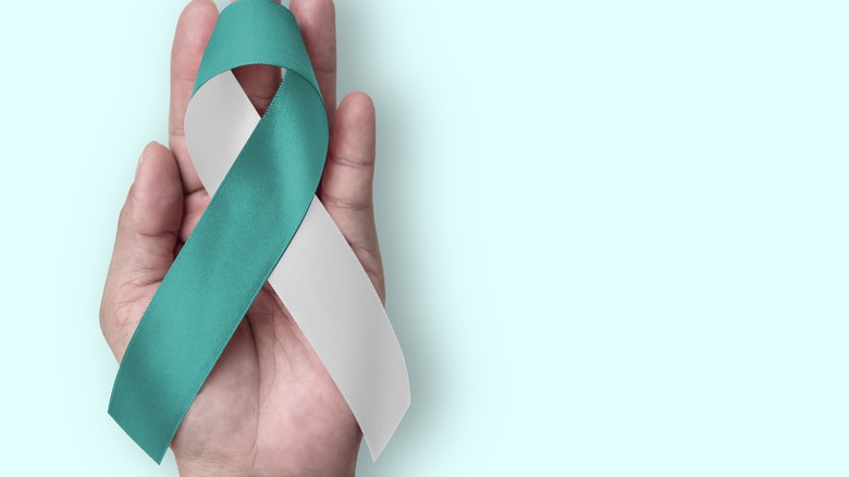 Cervical cancer ribbon on hand