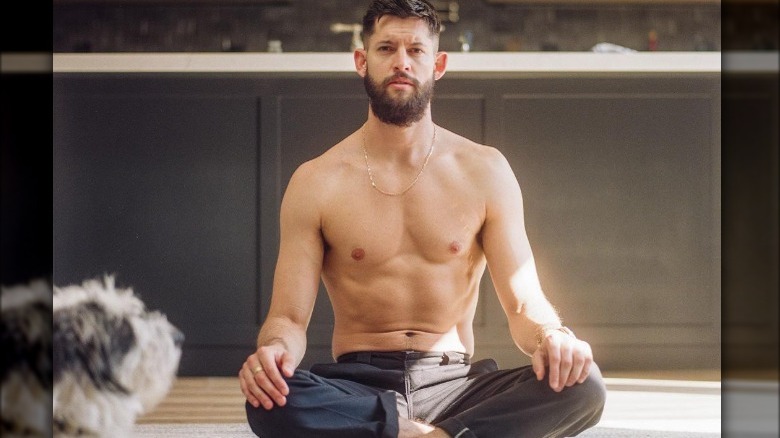 Hunter March meditating with his dog