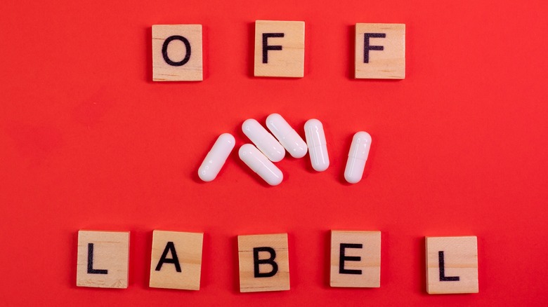 "Off label" spelled out with capsules in the middle
