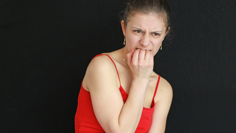 Woman biting her nails