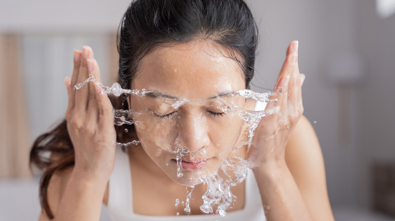 woman washing face