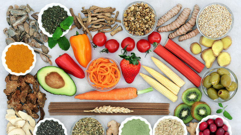 Fruits, vegetables, and herbs arranged on a table