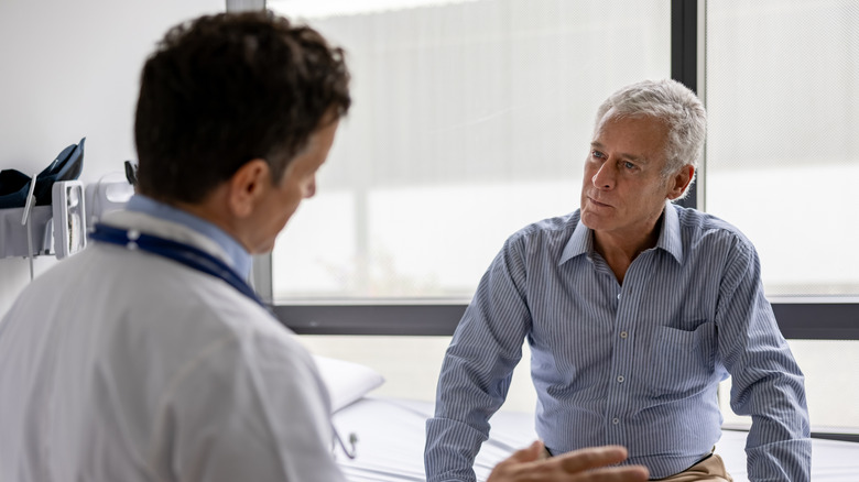 Man having a serious conversation with his doctor