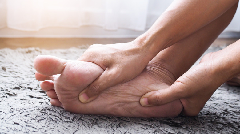 Closeup of person massaging their foot 