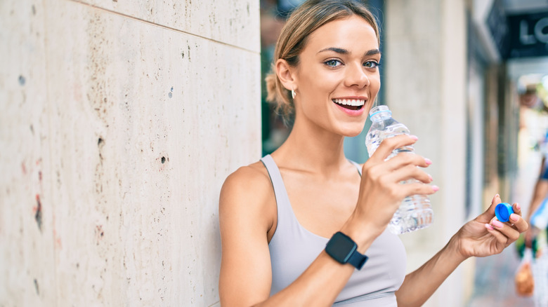 Blonde woman drinking water