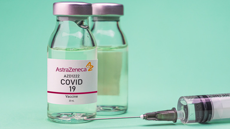 Two bottle of AstraZeneca vaccine with a syringe 