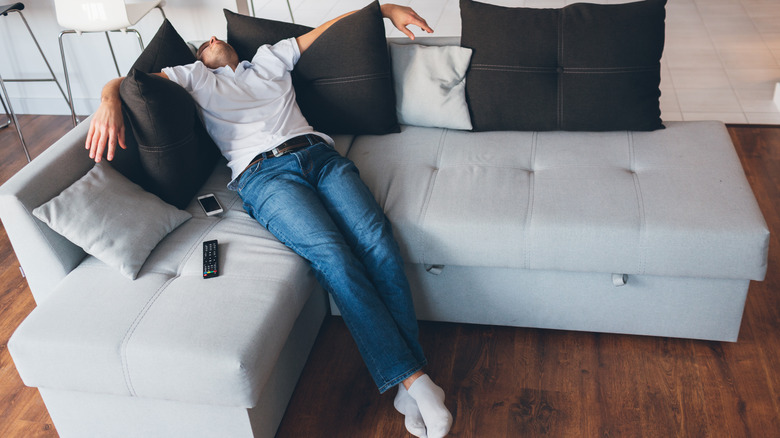 tired man on sofa