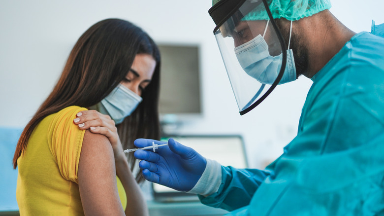 woman getting covid vaccine shot