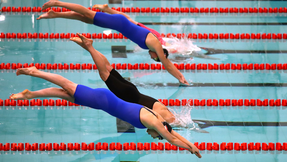 Swimmers compete in an event