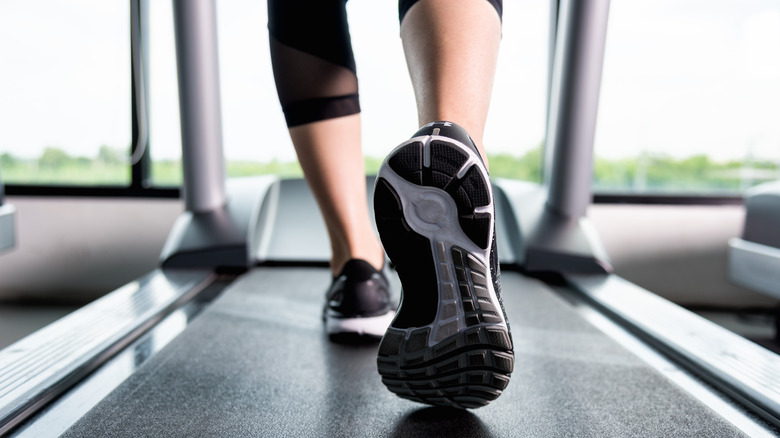 Feet walking on a treadmill