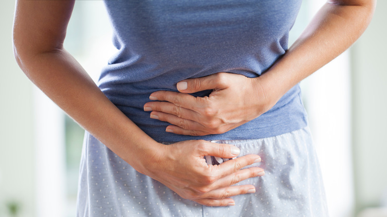 Woman feeling full and bloated