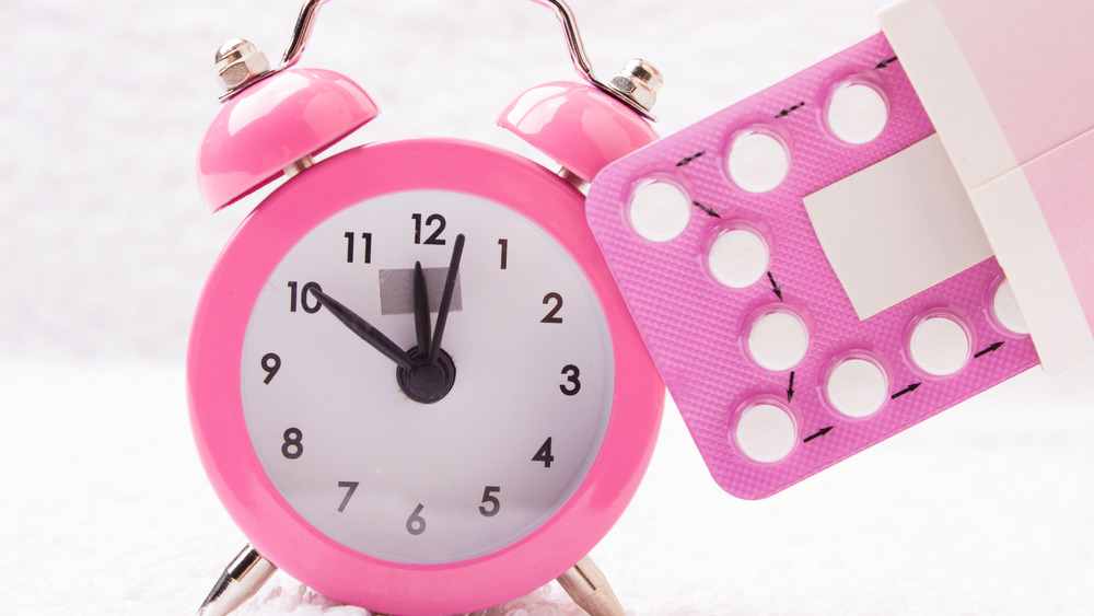 Birth control pill pack and alarm clock