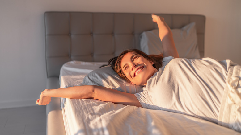 Woman waking up happy