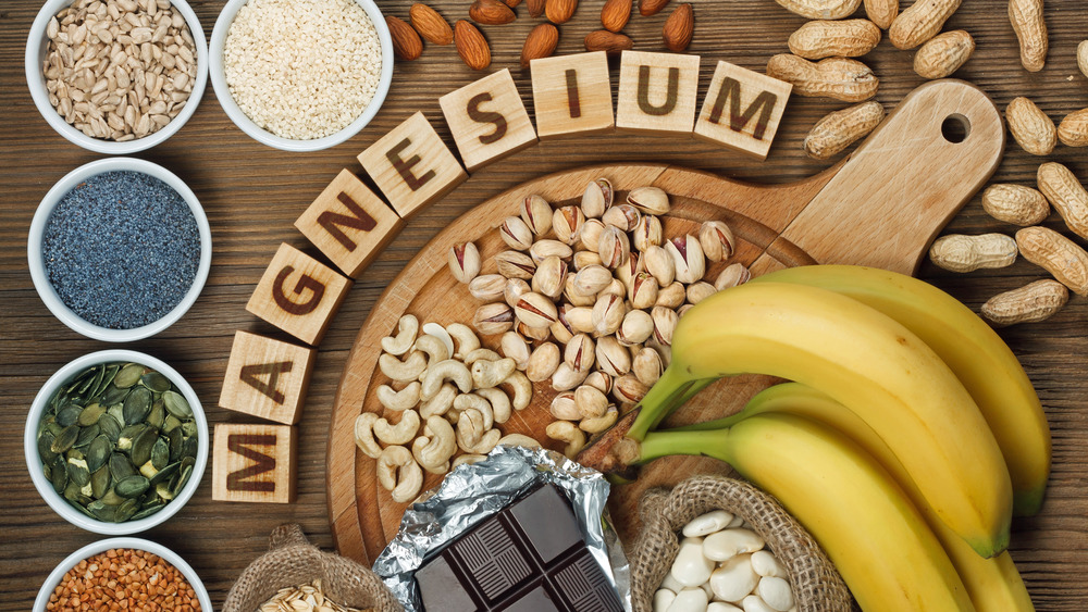 Magnesium spelled out in wooden letter blocks surrounded by food