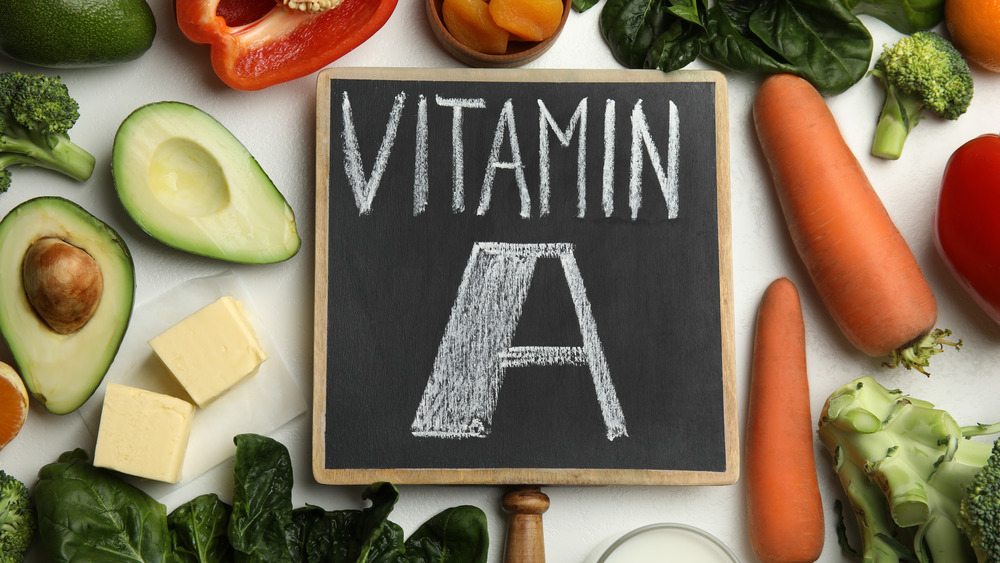 Vitamin A written on a chalk board surrounded by food