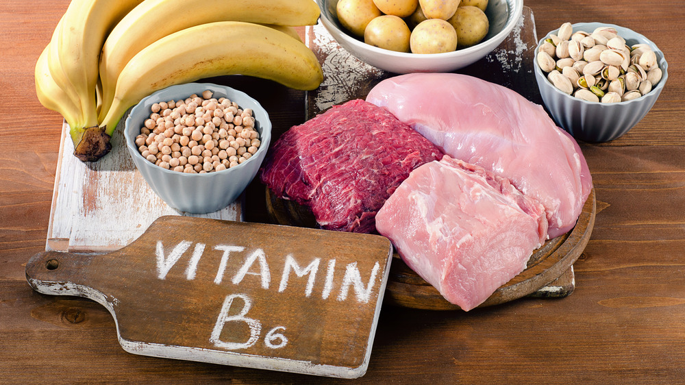 Vitamin B6 written on a wooden board next to food