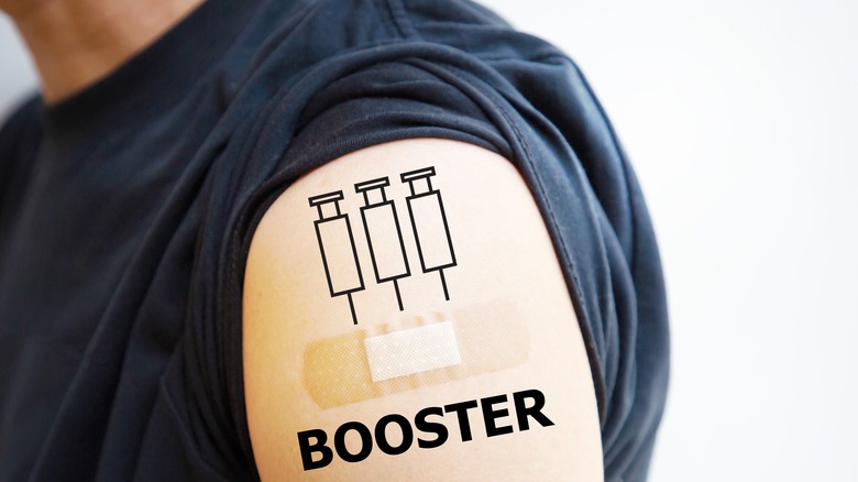 Booster shot bandaid on arm