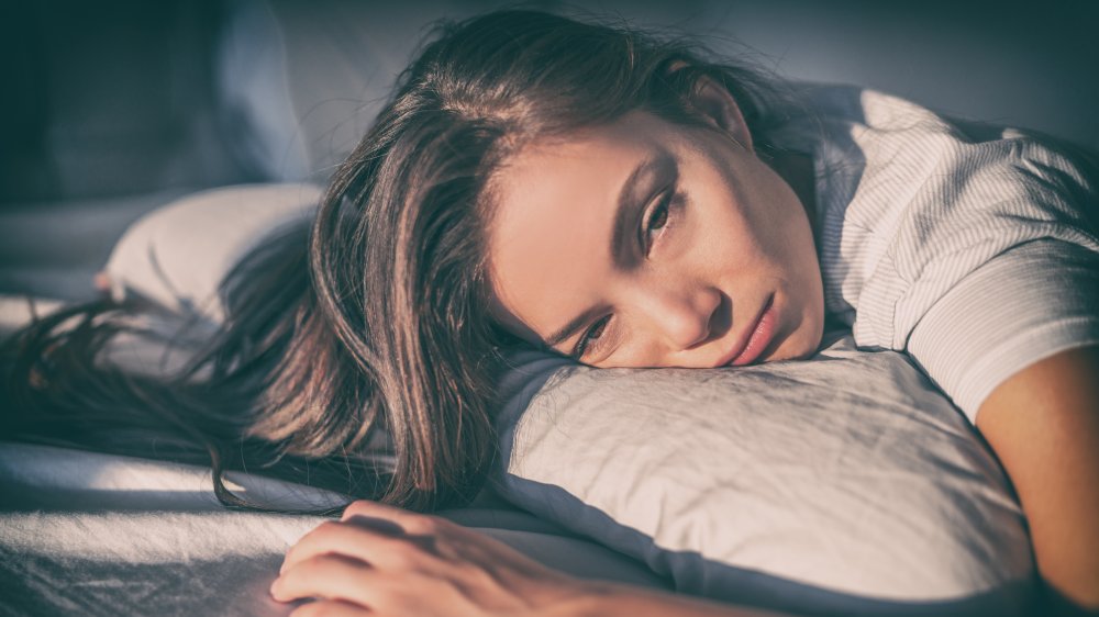 woman depressed in bed