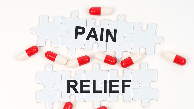 the words "PAIN RELIEF" surrounded by capsules