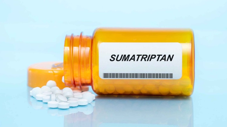 bottle of sumatriptan with tablets spilled out