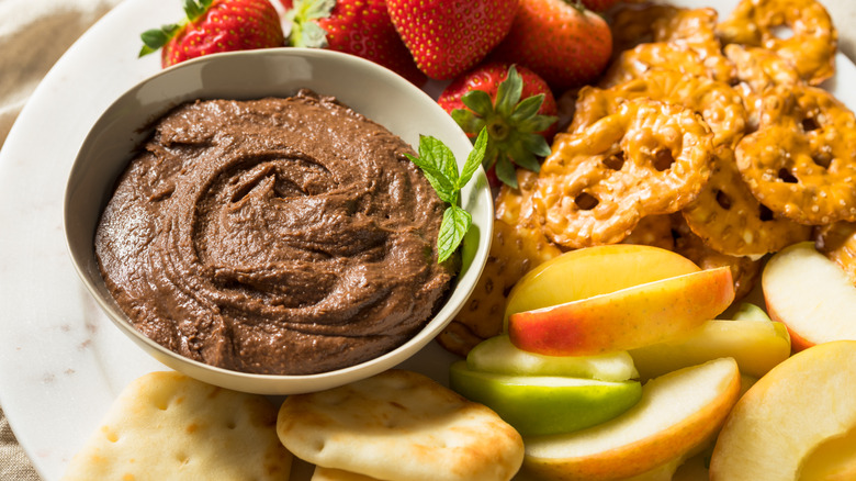 chocolate hummus with fruit, pretzels, and crackers