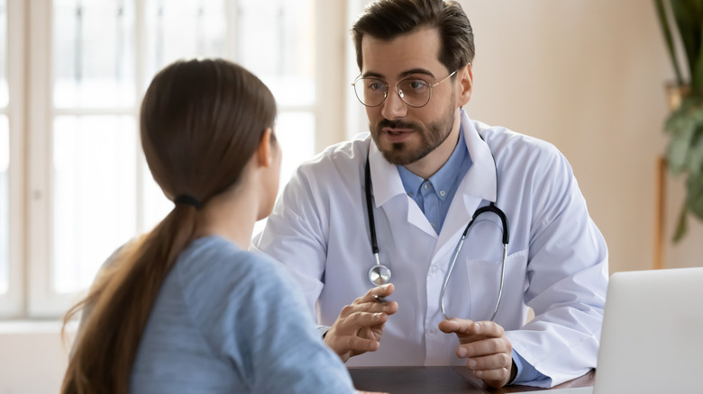 doctor talking to patient