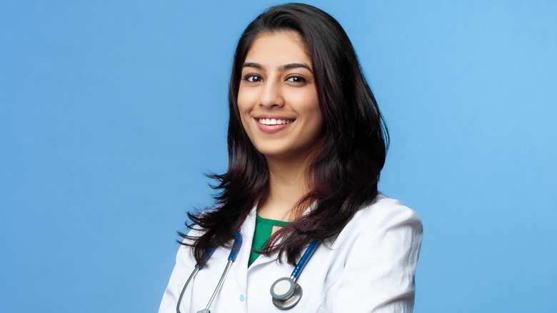 woman doctor smiling in lab coat