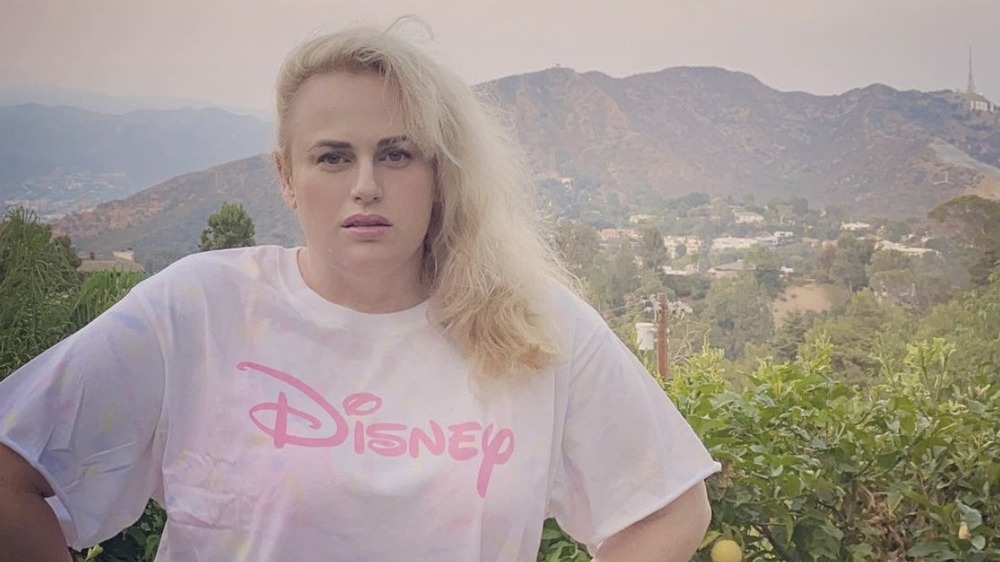 Rebel Wilson posing on a mountain hike