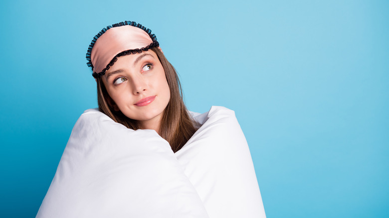 woman wrapped in a weighted blanket