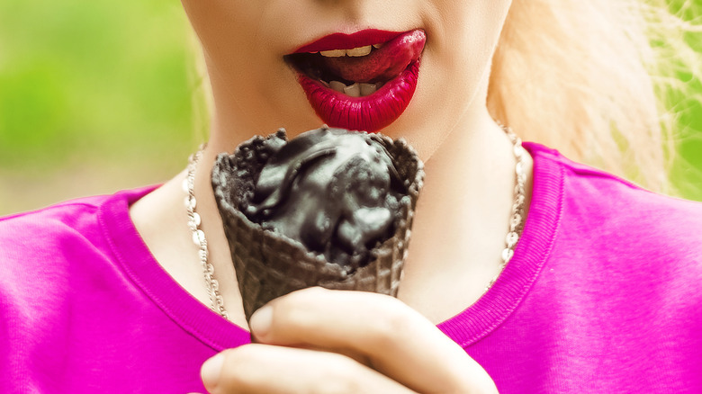 Woman eating charcoal ice cream