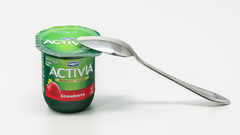 cup of Dannon's Activia yogurt with a spoon