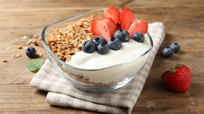 cup of yogurt with berries and granola