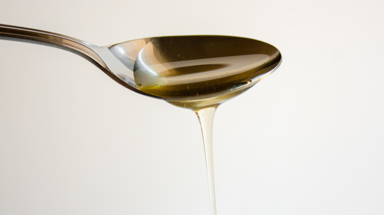Agave nectar dripping from a spoon