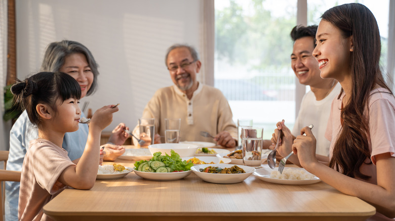 Family eating meal at table 