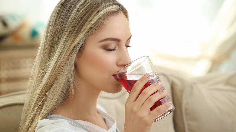 Woman drinking cranberry juice