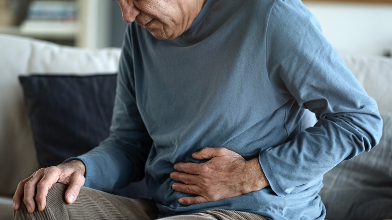 older man with stomach pain