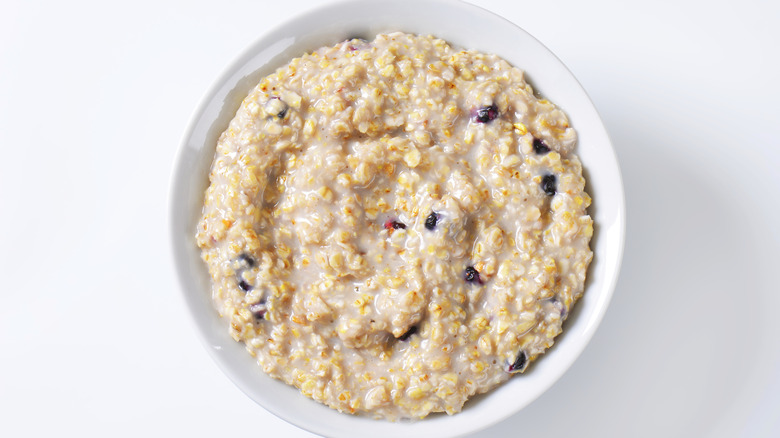 A white bowl filled with instant oats 