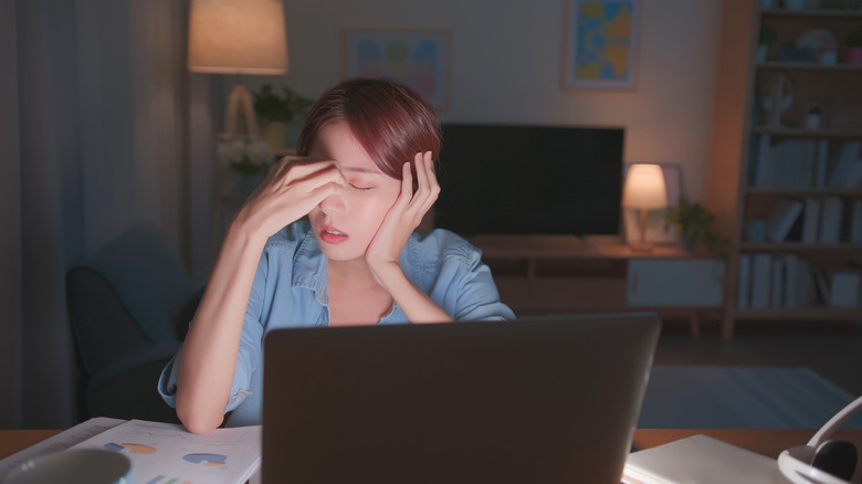 Tired woman at desk